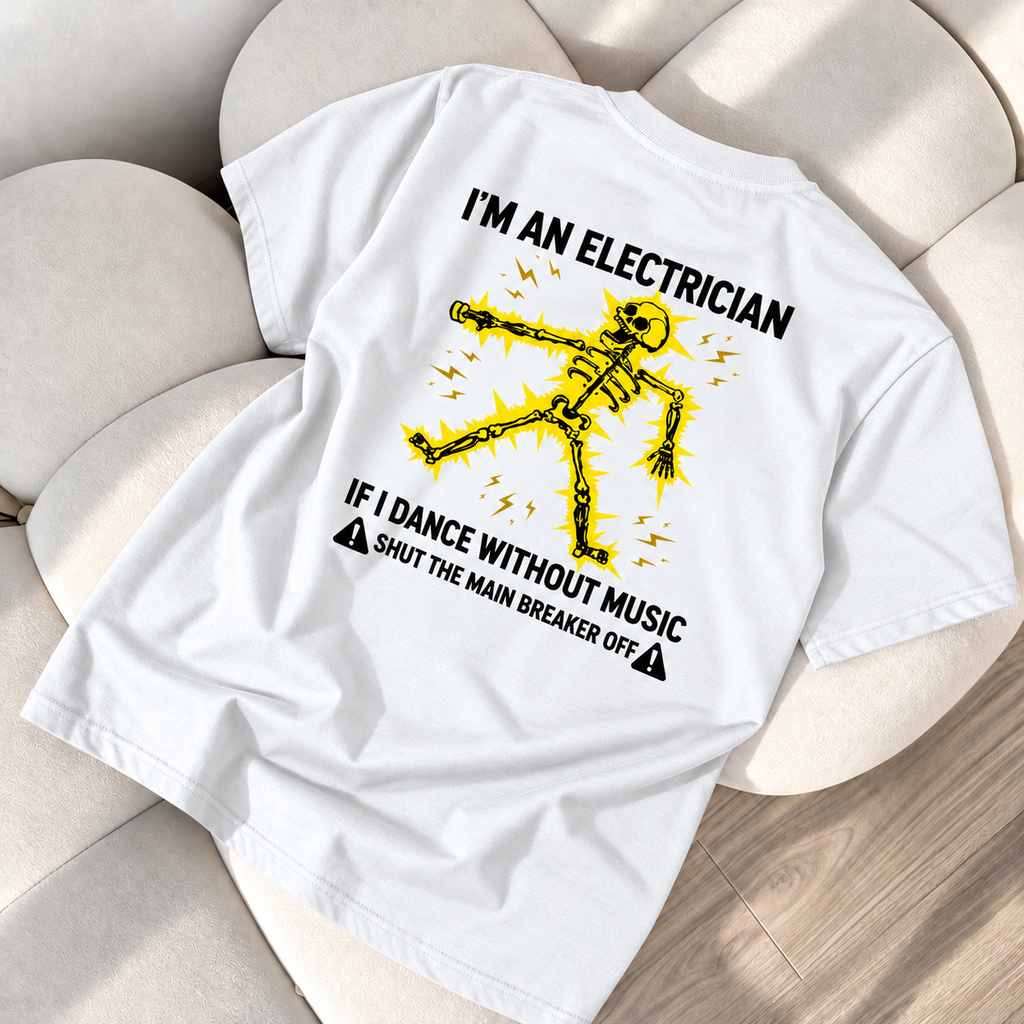 White T-shirt lying back side up on cream sofa: electrician skeleton design